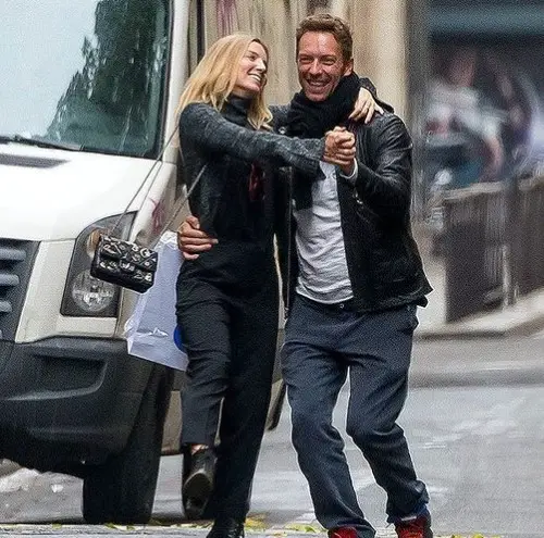 Annabelle Wallis and her former partner Chris Martin holding hands