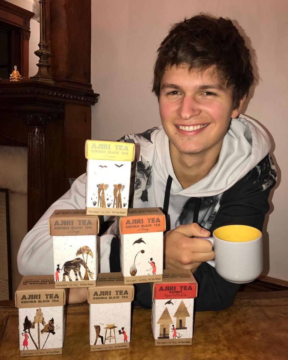 Ansel Elgort posing for a picture with his favorite tea brand
