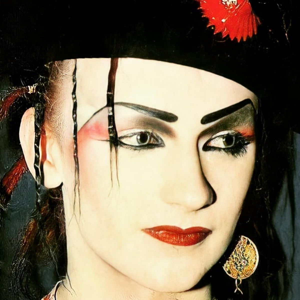 Gay singer Boy George strikes a pose in an old photo.