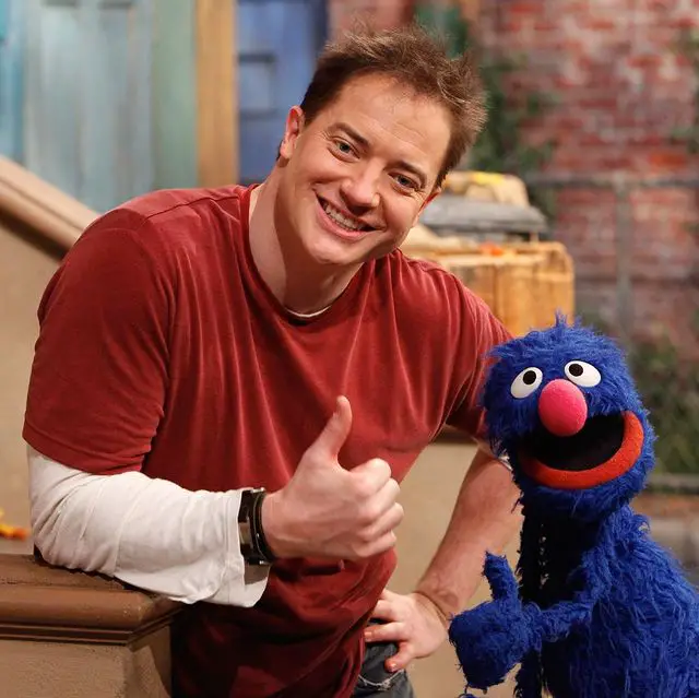 Brendan Fraser posing for a photo on the set of 'Sesame Street.'