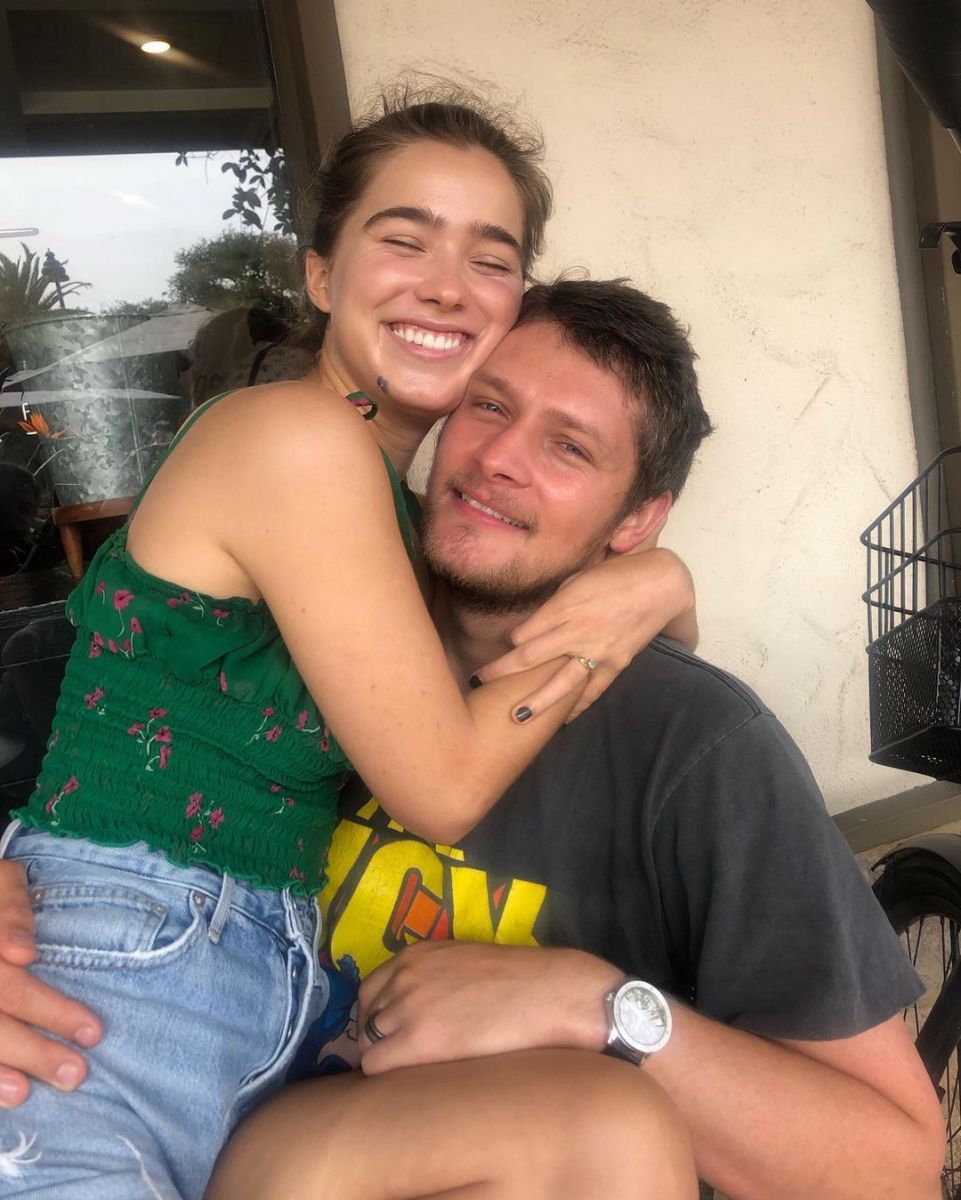 Brett Dier and his partner Haley Lu Richardson posing for a picture