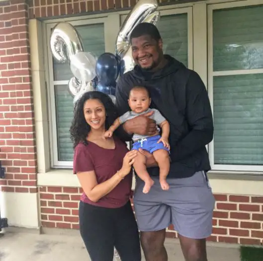 Calais Campbell with his wife and son.