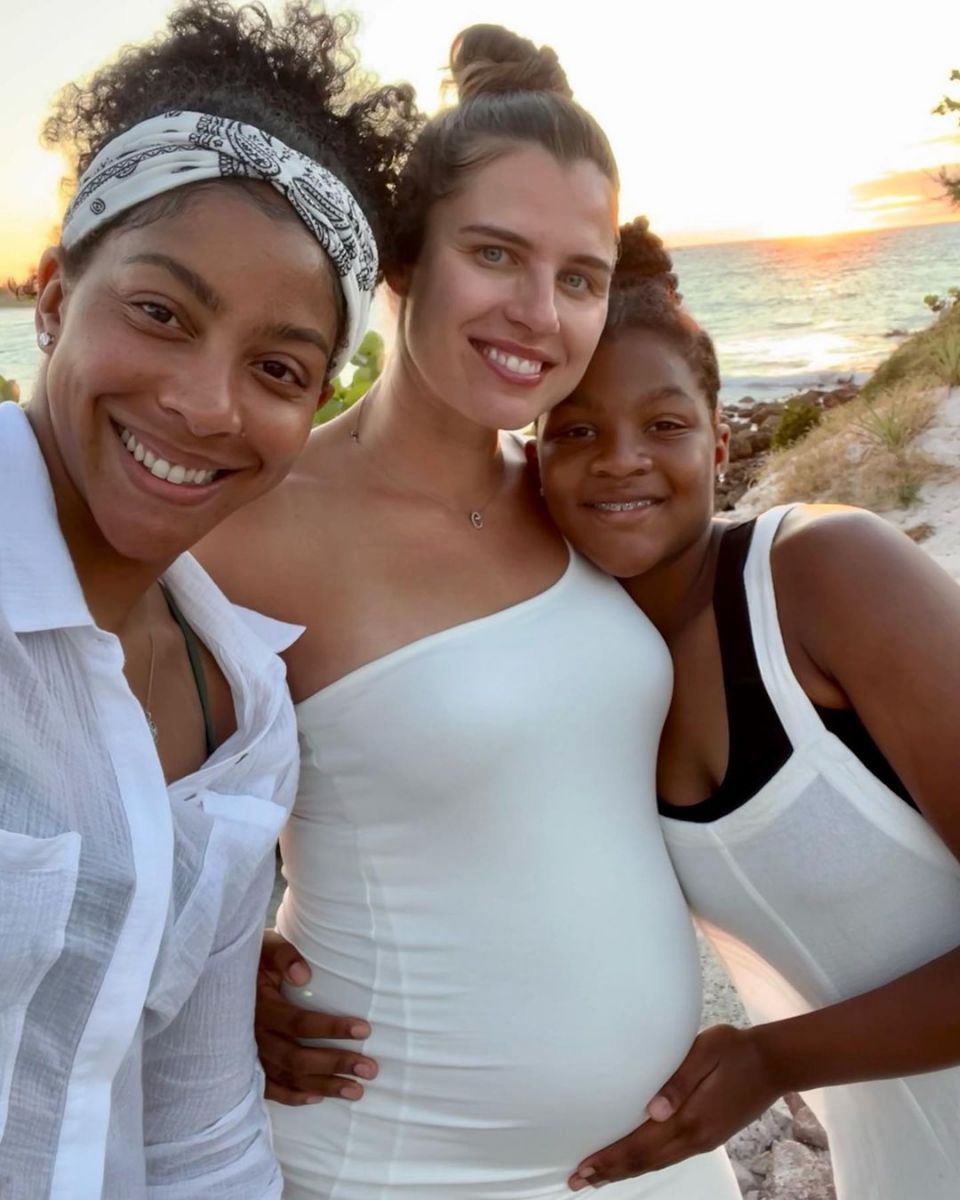 Candace Parker poses with her wife and daughter.