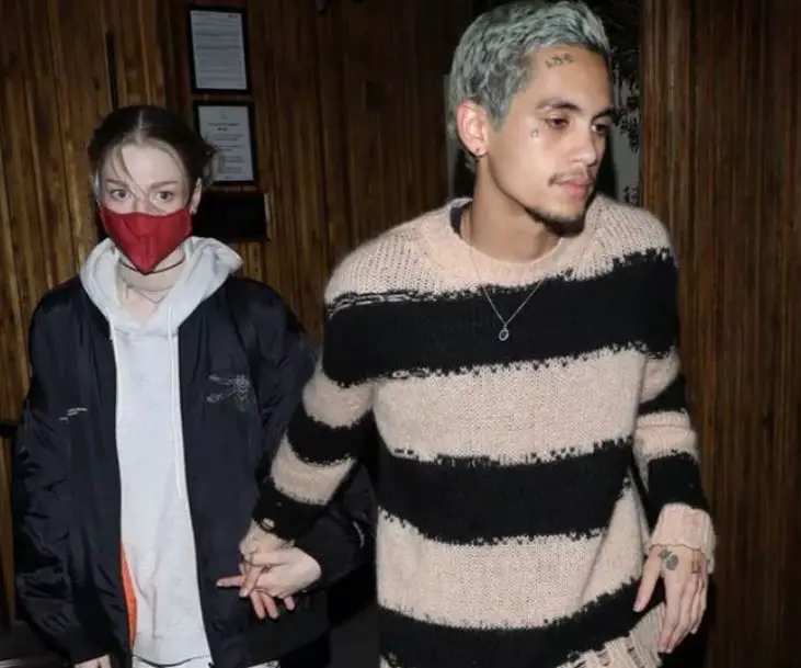 Photo of Euphoria actors Hunter Schafer and Dominic Fike holding hands that sparked dating rumors.