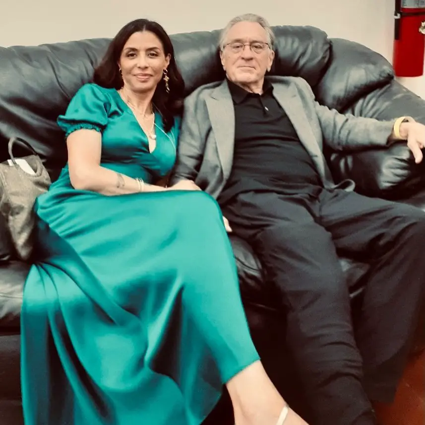 Drena posing for a picture with her father, Robert De Niro