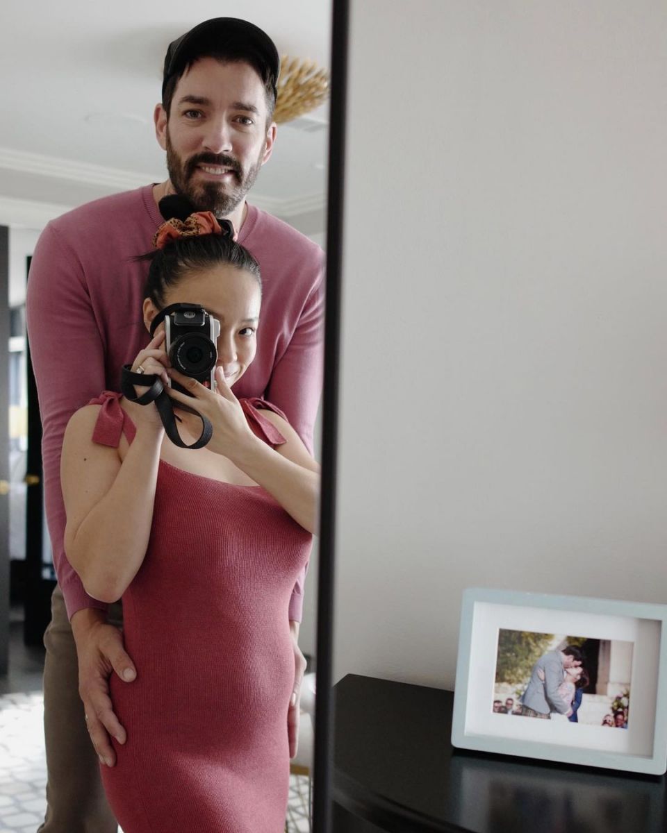 Drew Scott and his wife Linda Phan showing off her baby bump.