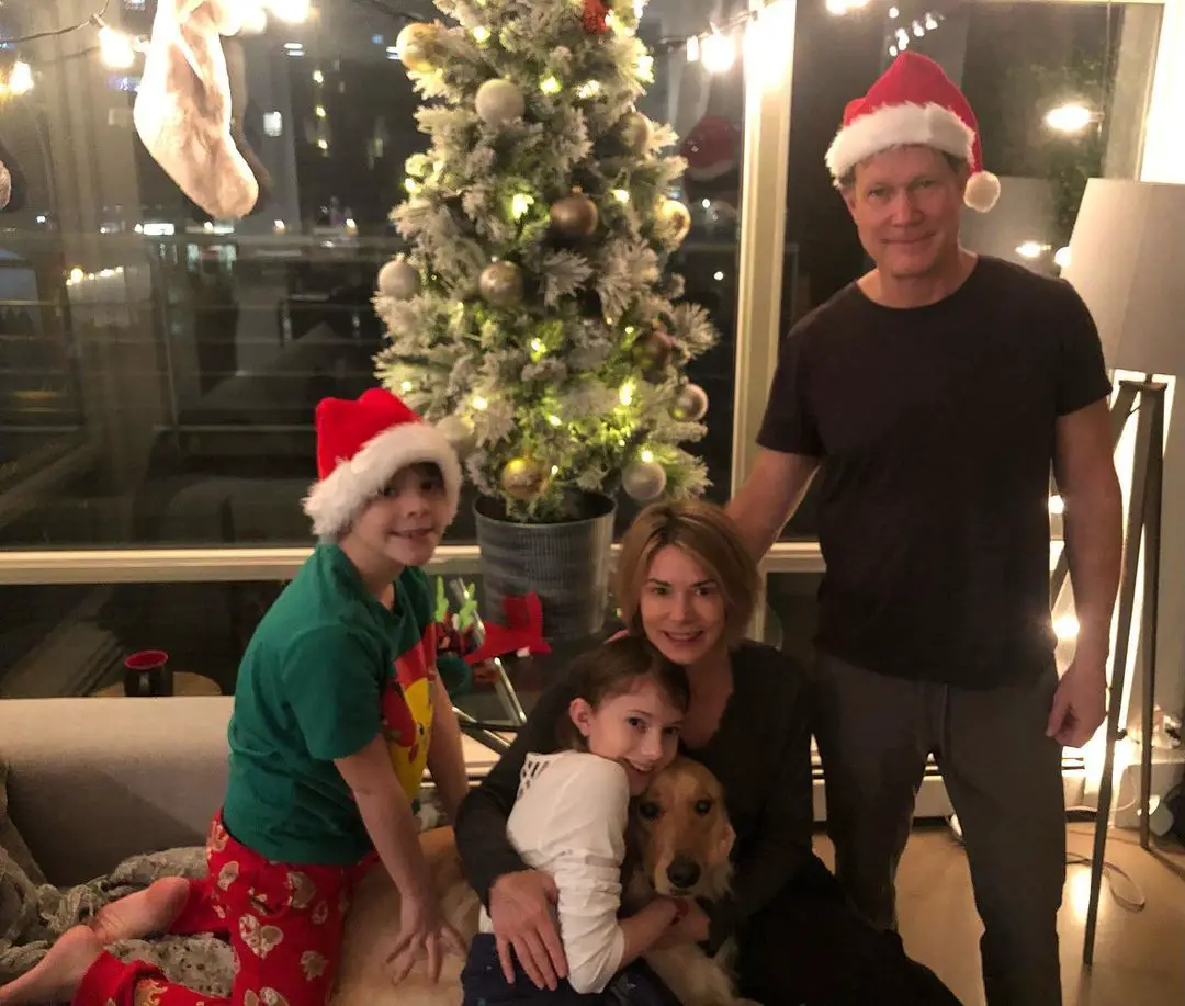 Dylan Walsh, his partner, and two children celebrating Christmas.