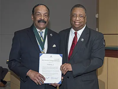 Angela Rye's father Eddie Rye receiving Medal Of Distinguished Service 