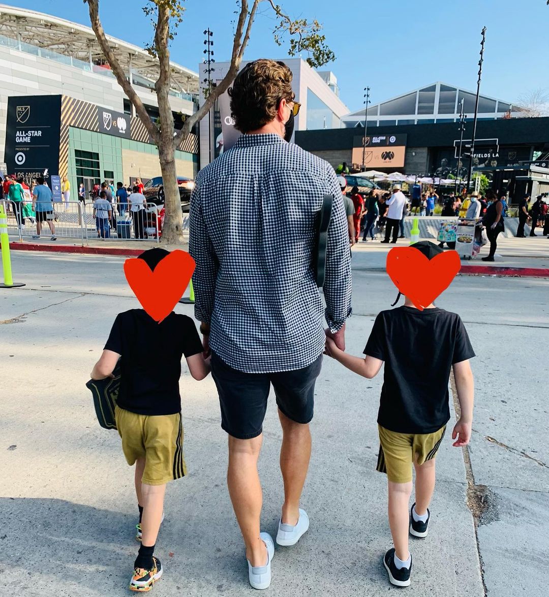 Josh Dallas walking with his kids.