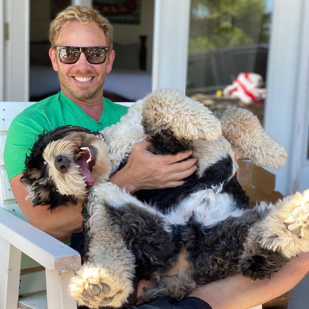 Ian Ziering posing for a picture with his dog, Rocket.