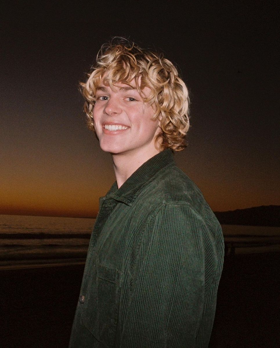 Jack Wright posing for a picture at a beach.