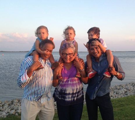 Juan Williams, Susan Delise, and Raffi Williams carrying Juan's Grandchildren in their shoulders