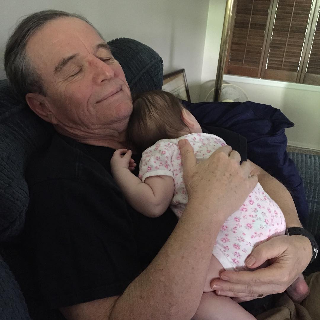 Jerry Mathers posing with his first grandchildren.