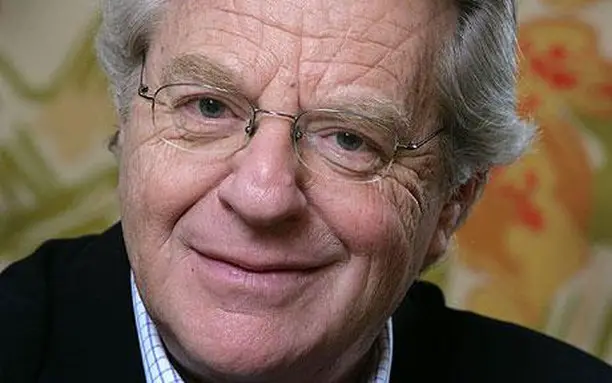Jerry Springer posing for a photo. 