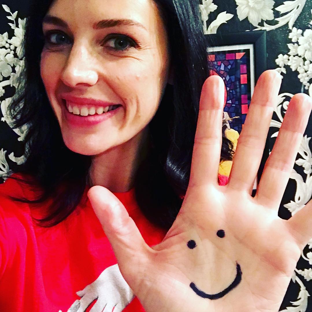 Jessica Pare showing off her distinctive teeth in a selfie.