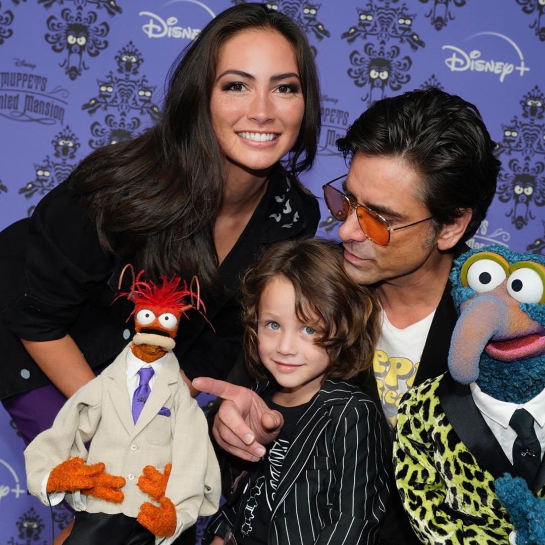 John Stamos with wifeÂ Caitlin McHugh and son Billy in the premiere of Muppets Haunted Mansion.