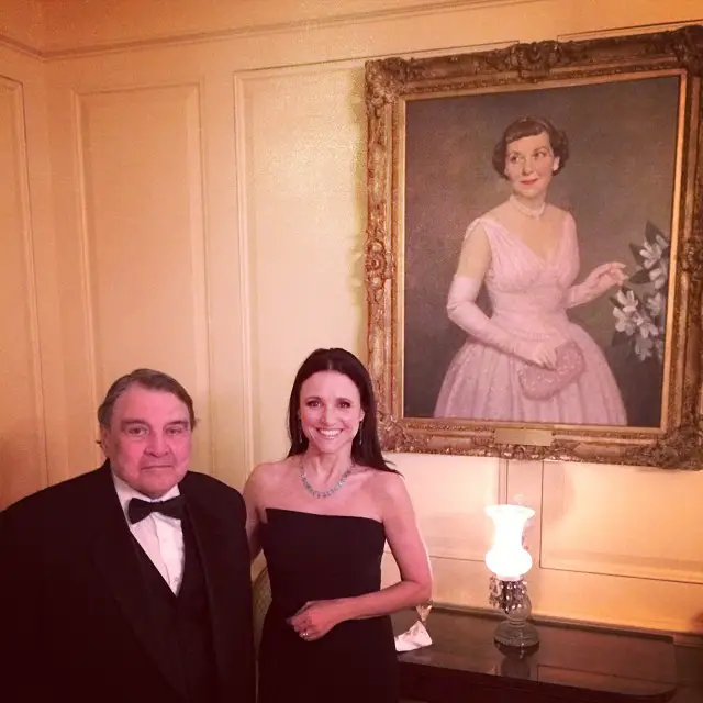 Julia Louis-Dreyfus and her father,Â William Louis-Dreyfus, posing in front of a picture of First LadyÂ Mamie Eisenhower