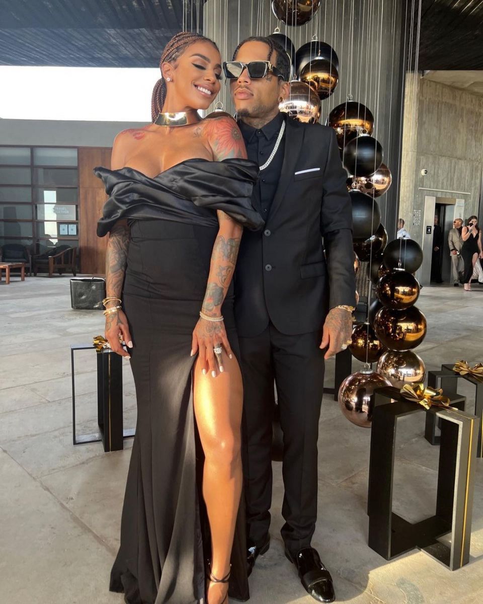 Kid Ink and his wife Asiah Azante flaunting their matching black outfits.