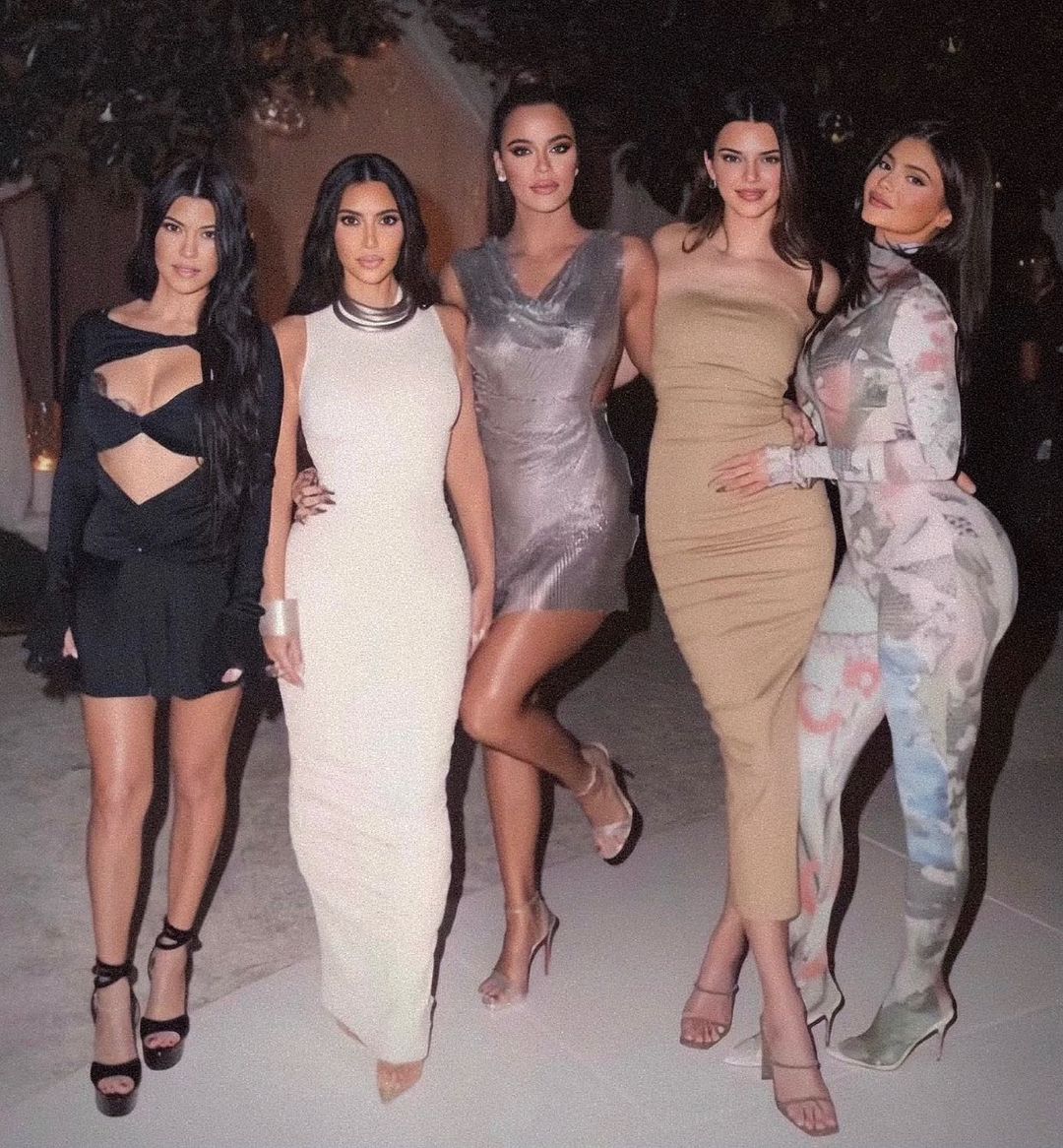 Kim Kardashian poses with her sisters.