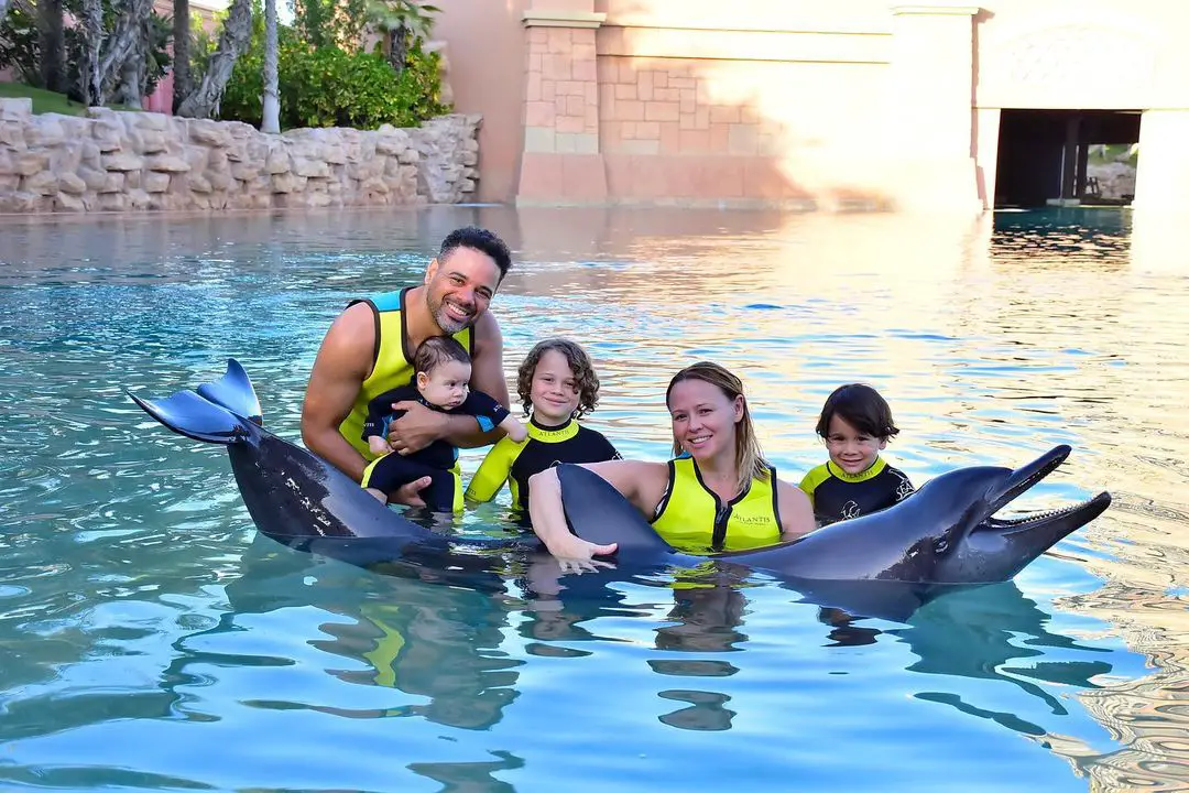 Kimberley Walsh posing for a picture with her husband and kids