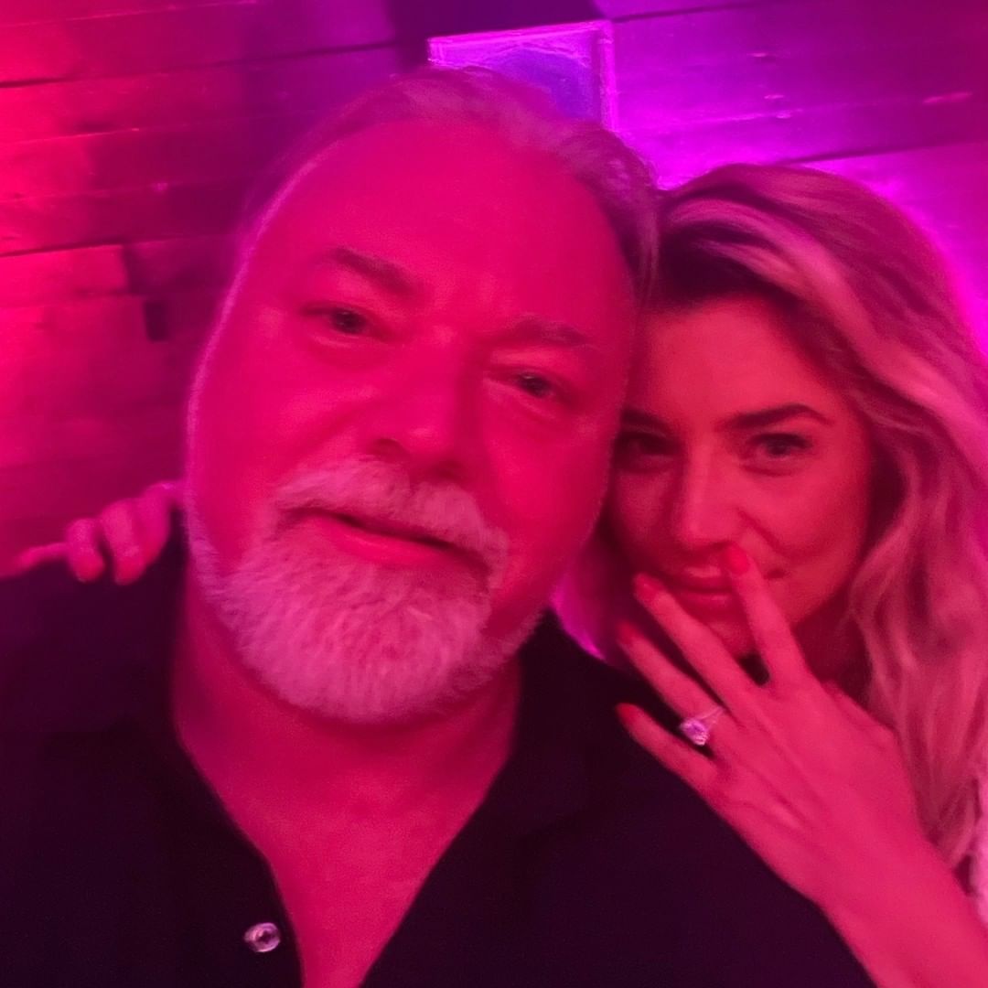 Kyle Sandilands posing with his girlfriend, Tegan Kynaston, after their engagement