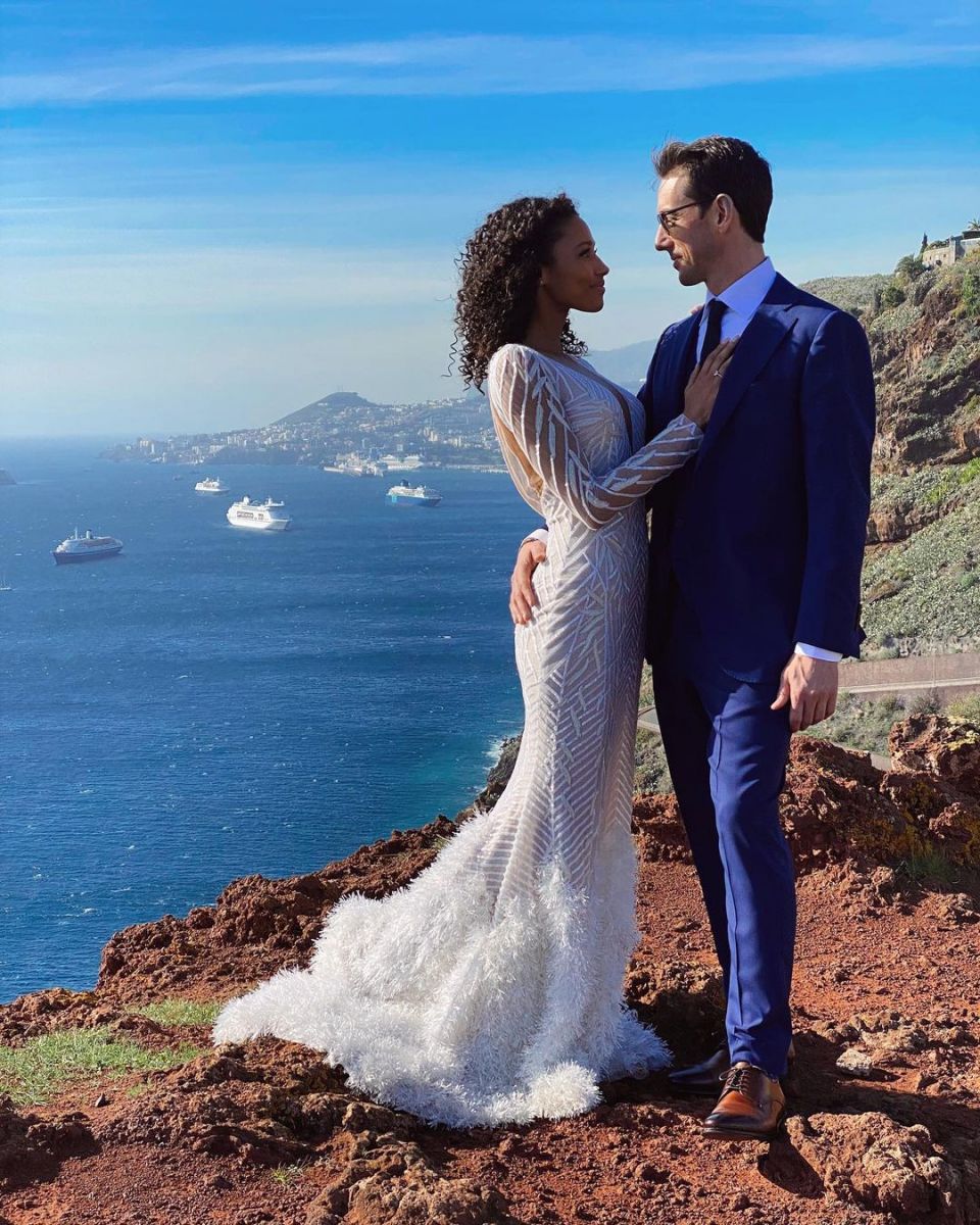 Kylie Bunbury and her husband Jon-Ryan Alan Riggins photographed at their wedding.