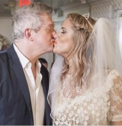 Louis Walsh with fake wife Caroline Flack at their spoof wedding in Las Vegas in 2012.