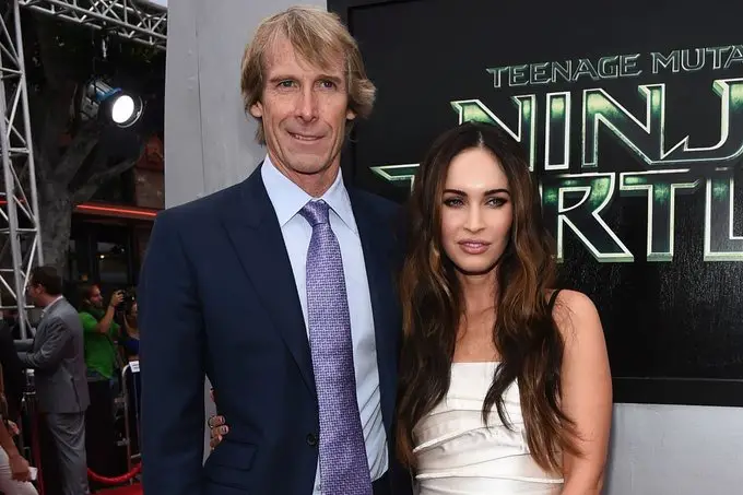 A picture of Megan Fox and Michael Bay together at an event.