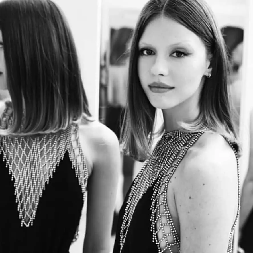 Mia Goth is proud of her light eyebrows.
