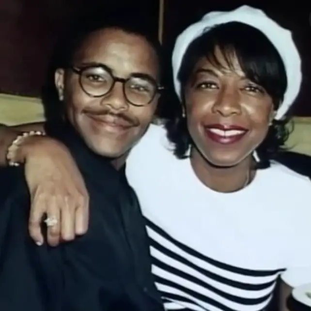 Natalie Cole posing with her son, Robbie. 