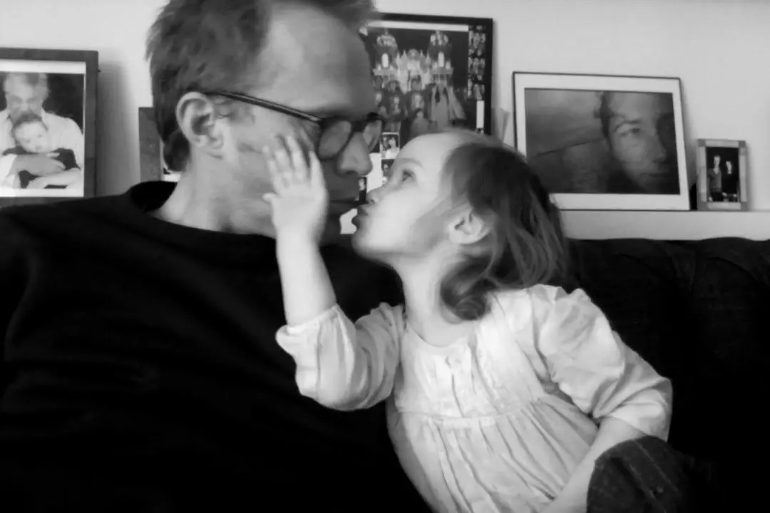 Paul Bettany posing with his youngest out of three children, Agnes