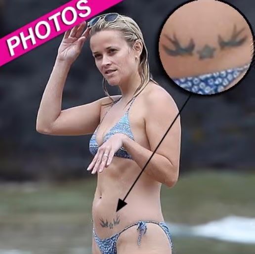 Resse Witherspoon's flaunting her body ink while on a vacation in Hawaii, with hubby Jim Toth and kids.
