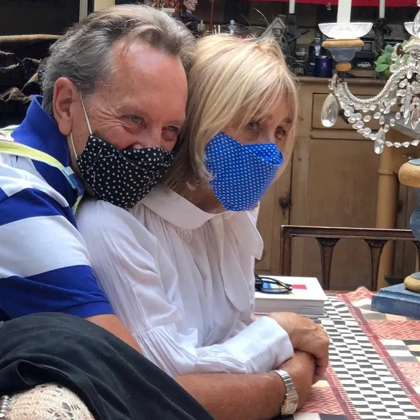 Richard E. Grant hugging his wife, Joan Washington.