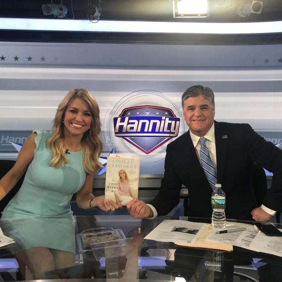 Sean Hannity and Ainsley Earhardt posing for a photo