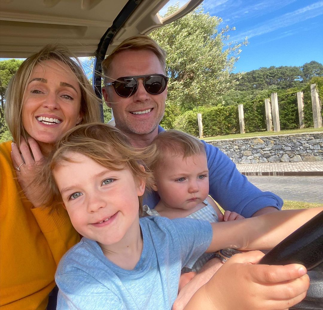 The singer posing with his wife, Storm, and their children.