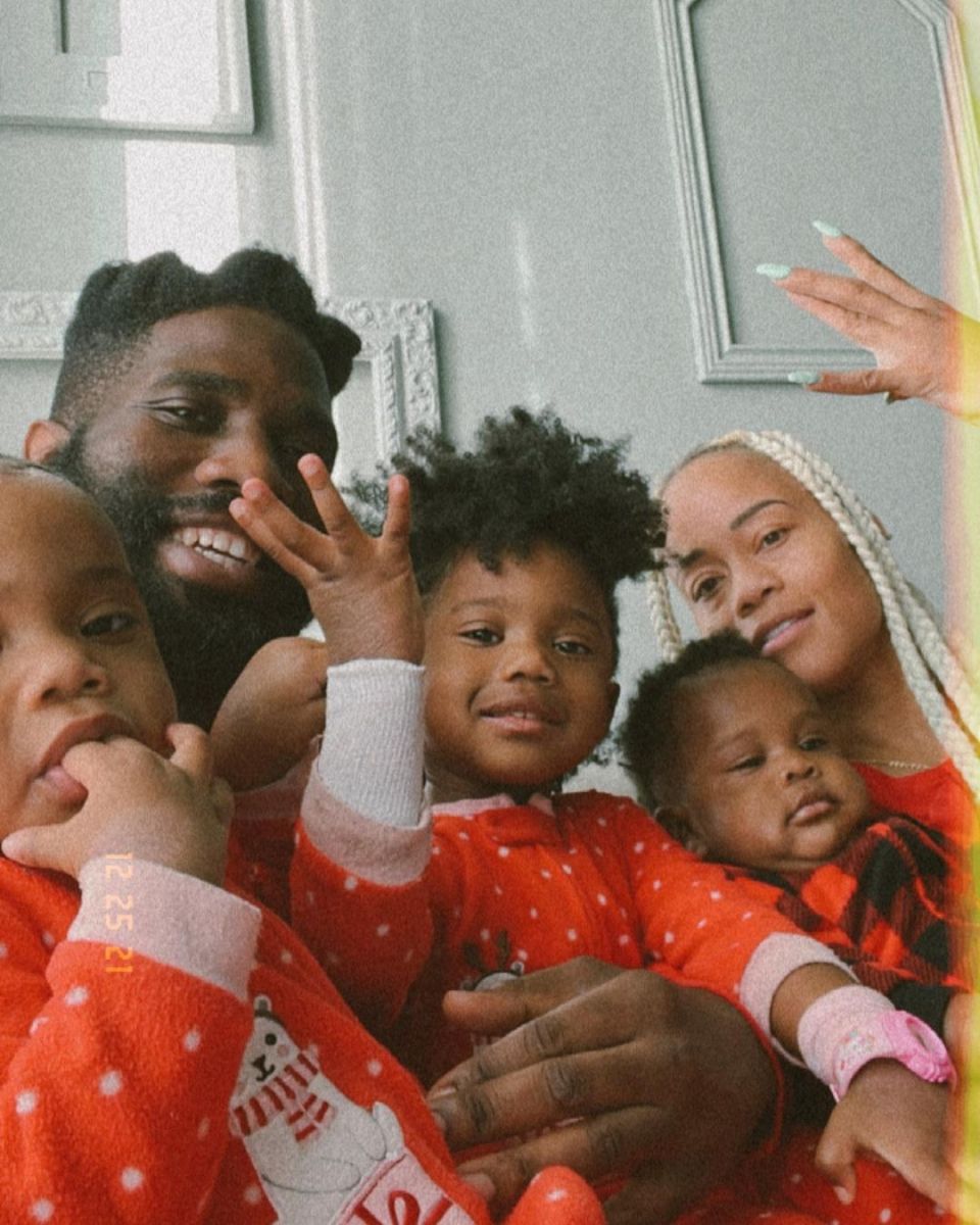Tobe Nwigwe, posing with his wife, Fat Nwigwe, and his kids.