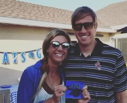 April Ross with husband posing for a picture