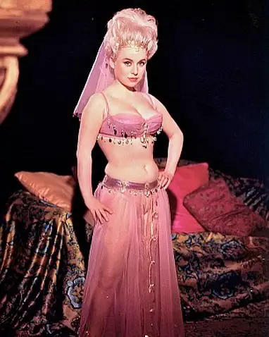 Late Barbara Windsor who is survived by her husband on a movie set.