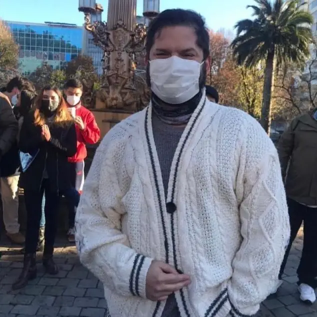 President Gabriel Boric wearing Taylor Swift's merch.