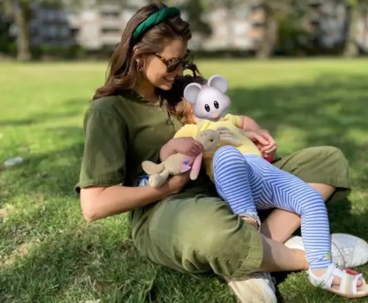 Ellie Taylor with her baby on an Instagram post talking about motherhood