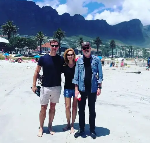 With her husband and dad