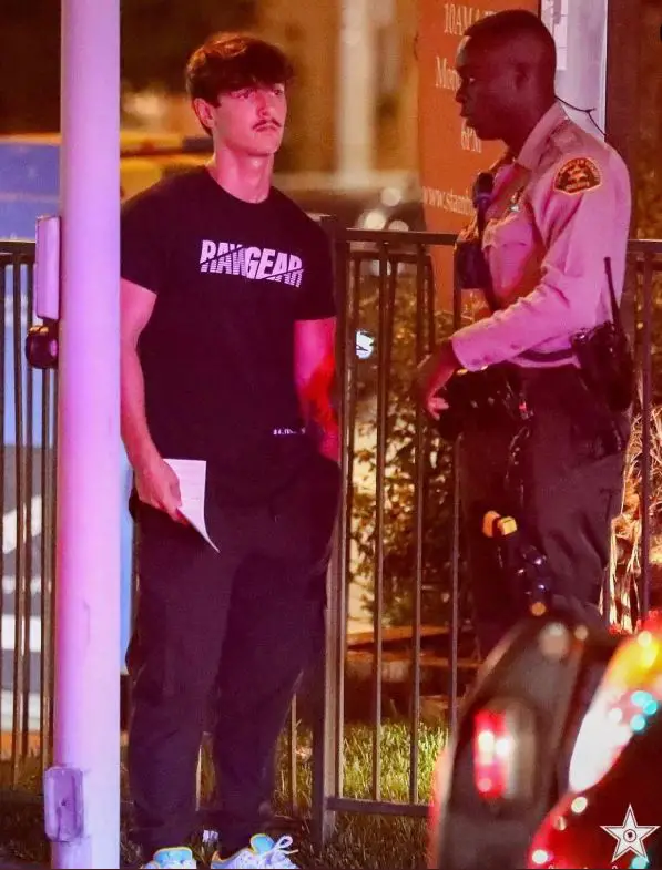 Bryce Hall talking to a cop after the car accident