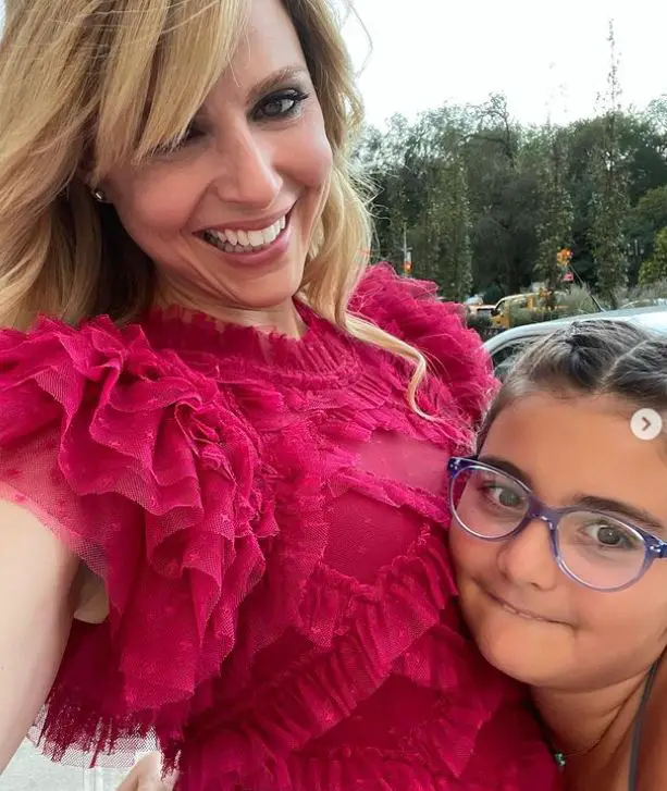 Cara Buono and her daughter at a wedding celebration 