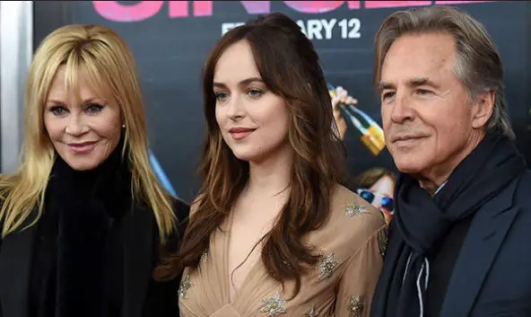 Dakota Johnson with her parents, father Don Johnson and mother Melanie Griffith.