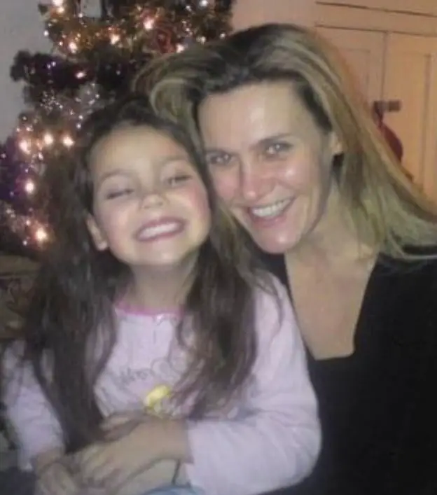 A throwback photo of Emily Carey and her parent.