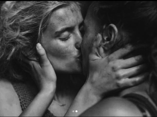 Mia Healey and Erana James kissing on Thw Wilds leading fans to wonder if they are dating