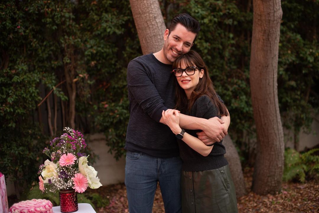 Jonathan Scott hugging his girlfriend Zooey Deschanel at an intimate party he threw to mark her 42nd birthday.