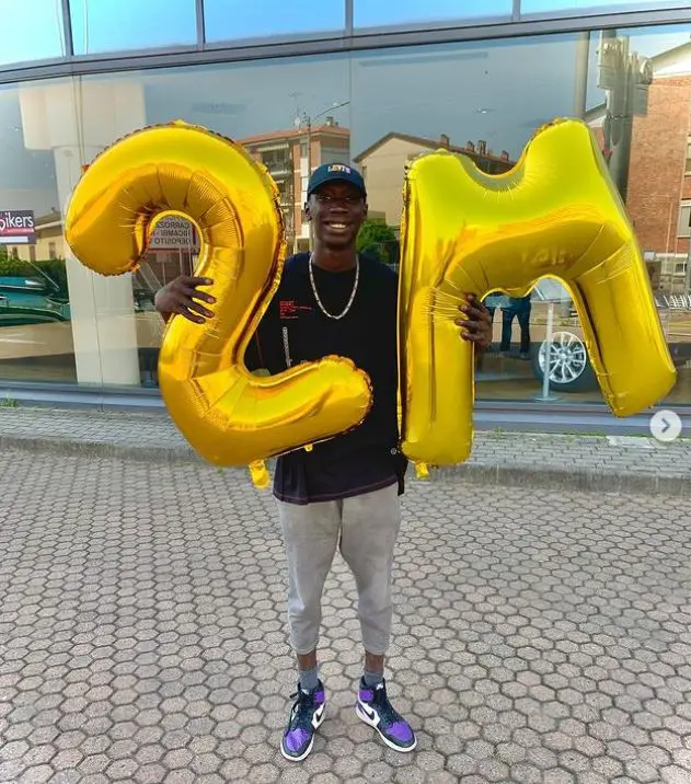 Khaby Lame celebrating earning 2 million followers