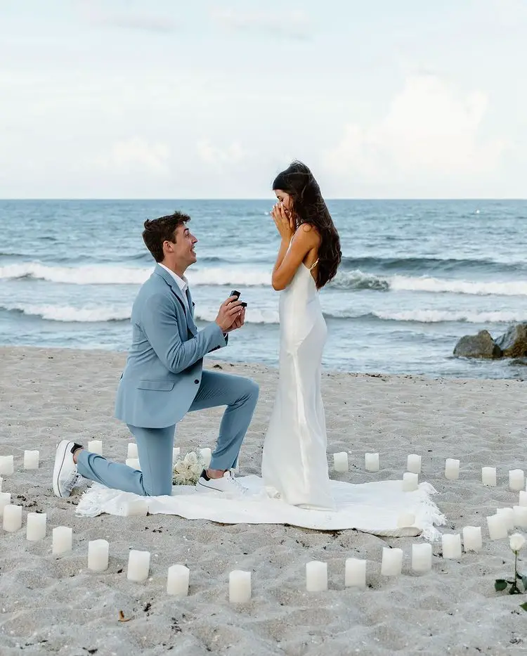 Madison Prewett holds her excitement in as boyfriend Grant Troutt proposes to her in Palm Beach, Florida.