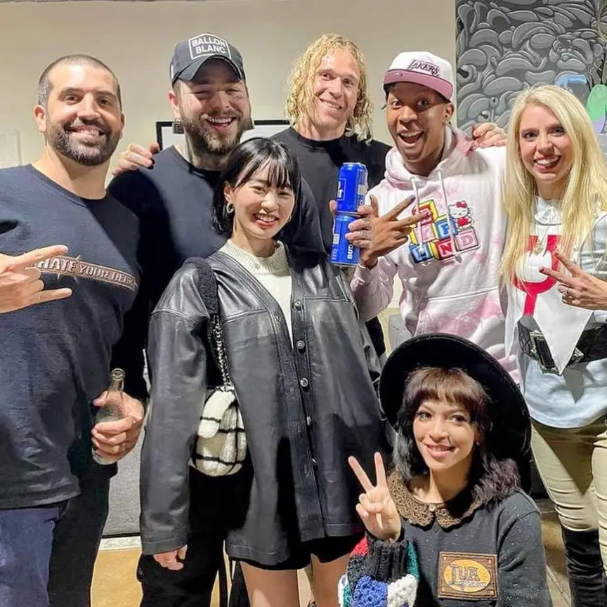 Post Malone poses for the camera with his rumored girlfriend, Jamie.